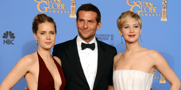 Amy Adams, Bradley Cooper and Jennifer Lawrence, winners of the award for best motion picture - comedy or musical for American Hustle at the Golden Globe Awards. Photo / AP