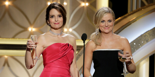 Tina Fey and Amy Poehler host the 71st annual Golden Globe Awards at the Beverly Hilton Hotel. Photo/AP