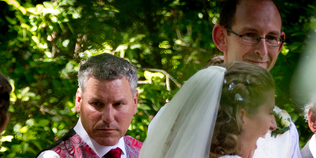Groomsman Paul Wilson (left) with newly married couple David Bain and Liz Davies after their wedding ceremony at Trent's Vineyard in Christchurch this afternoon. Photo / Sarah Ivey