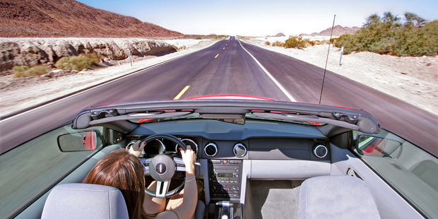 The vast, varied landscapes, small towns and big cities that fly-drivers pass through make the practical matters of driving on the right and learning a few new laws well worth it. Photo / Getty Images