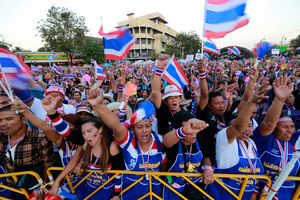 Thai anti-government protesters shout and cheer during a rally at the Democracy Monument in Bangkok. Photo / AP