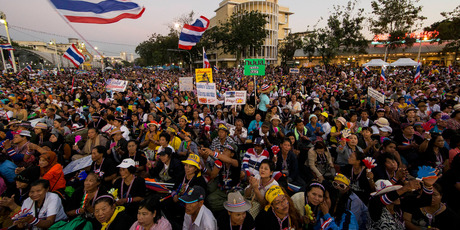 Thai anti-government protesters gather during a rally at the Democracy Monument, Bangkok. Photo / AP