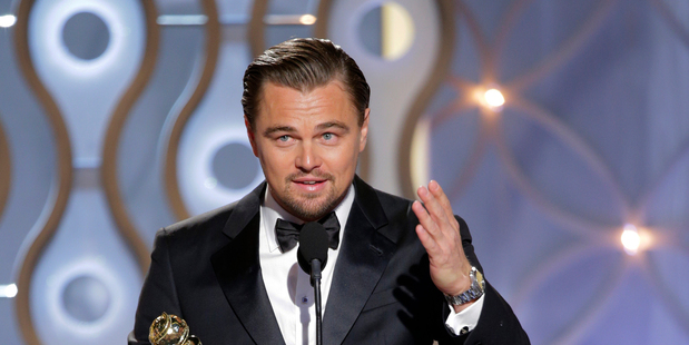 Leonardo DiCaprio accepts the award for best actor in a motion picture comedy for his role in The Wolf of Wall Street.