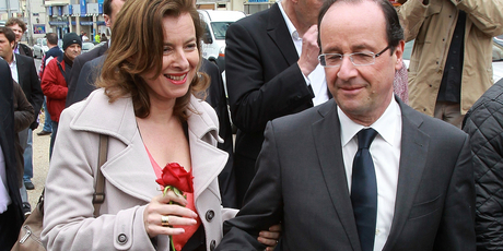 2012 file photo of Francois Hollande offering a rose to his companion Valerie Trierweiler, who's been hospitalised after his affair revelations. Photo / AP