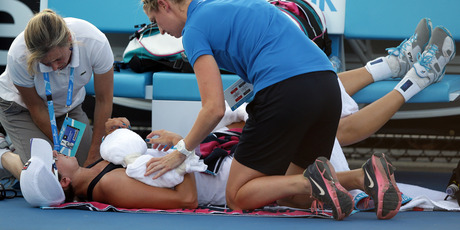 Yaroslava Shvedova of Kazakhstan receives treatment by trainers during her first round match against Sloane Stephens of the U.S. at the Australian Open. Photo / AP
