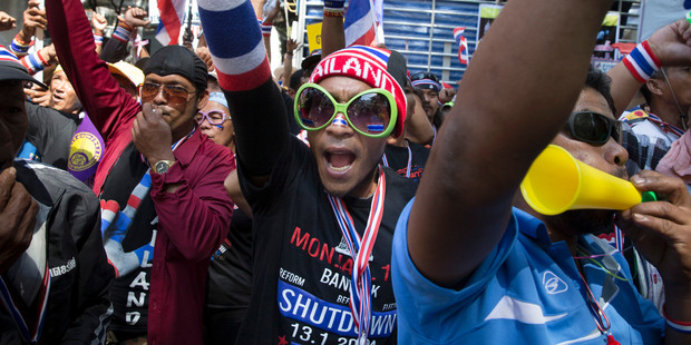 Anti-government protestors chant towards the Royal Thai Police headquarters in Bangkok. Photo / AP