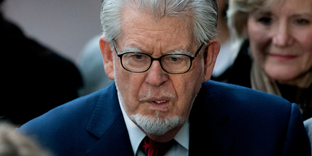 Australian-born veteran entertainer Rolf Harris leaves after his hearing at Southwark Crown Court in London. Photo / AP