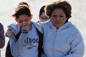 A student, left, is hugged following a shooting at Berrendo Middle School. Photo / AP