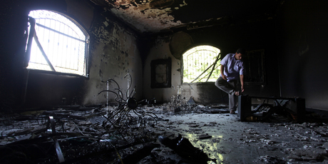 A Libyan man investigating the inside of the US Consulate in Benghazi, Libya after the attack that killed ambassador Chris Stevens. Photo / AP