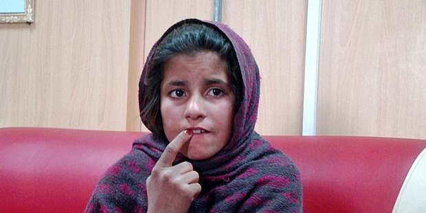 Spozhmai, 10, is held in a border police station in the Khan Neshin district. Photo / AP
