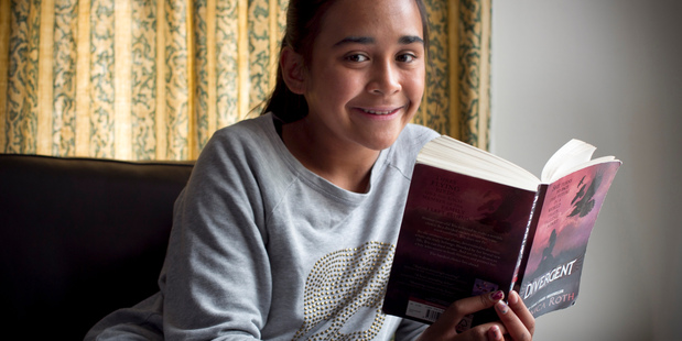 Jane Charlton, 11, is enthralled by Veronica Roth's Divergent series, dubbed the next Hunger Games. Photo / Natalie Slade