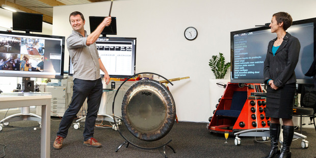 SLI Systems chief executive and co-founder Shaun Ryan strikes a gong as the company debuts on the NZX main board.