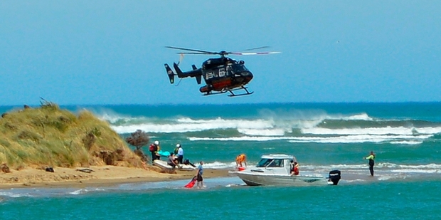 A rescue helicopter joined in the search for the teenager, who was found on the shore half an hour after her boat capsized in rough seas. Photo / Otago Daily Times