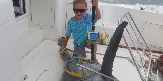 MIGHTY: Eight-year-old Hunter Scott landed a black marlin 10 times his own weight. PHOTO/SUPPLIED