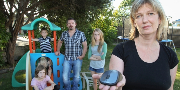 Emma George and her family, at home in Napier, lost 14 years' worth of photos and videos when they were burgled. A laptop along with backup drives and other items were stolen from the house. The laptop mouse is all that is left. Photo/Glenn Taylor