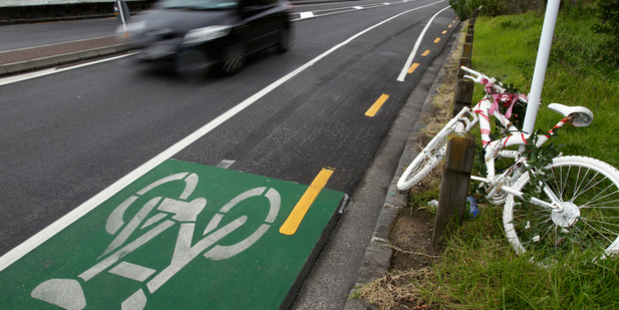 A bike painted white is parked opposite the section of road on Tamaki Drive where 27-year-old Jane Bishop died in 2010. Photo / Dean Purcell