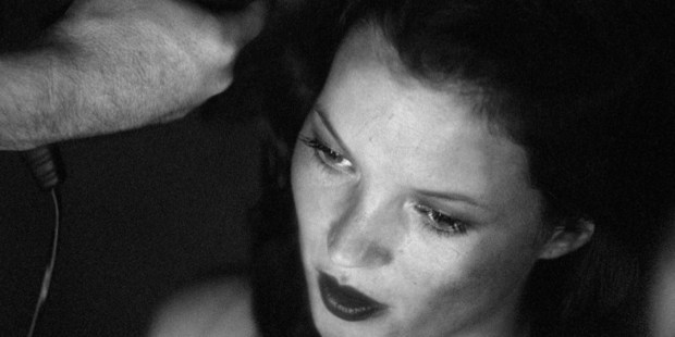 Kate Moss having her hair styled backstage at at fashion show in London in 1999. Photo / Getty