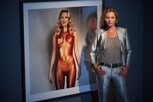 Kate Moss poses next to a photograph entitled 'Body Armour' by Allen Jones. Photo / Getty