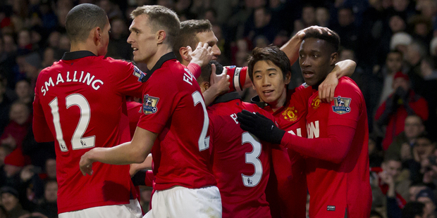 Manchester United's Danny Welbeck, right, celebrates with teammates after scoring against Swansea City. Photo / AP
