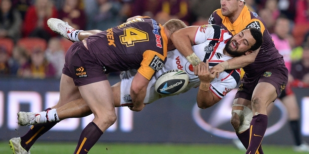 The Broncos’ defence put a stop to Ben Matulino of the Warriors during the clash at Suncorp Stadium in Brisbane on Saturday night. Photo / Getty Images