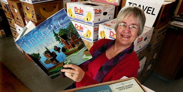 Jessie Bell sorting books. Photo / John Stone