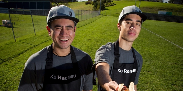 Te Ngaronoa Mahanga (left) and Te Karehana Gardiner-Toi will hand out sausages to people who answer questions about the macron. Photo / Sarah Ivey