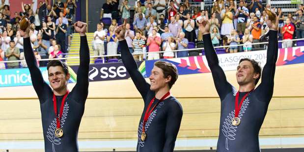 New Zealand Men's Sprint team Sam Webster, Ethan Mitchell and Eddie Dawkins celebrate their Gold Medal. Photo / Greg Bowker