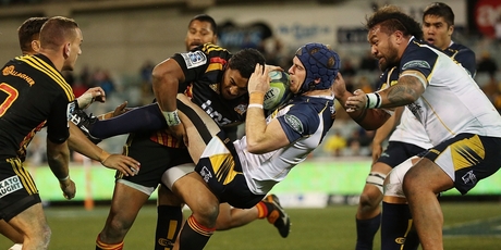Pat McCabe of the Brumbies runs into some strong Chiefs defence in Canberra. Photo / Getty Images