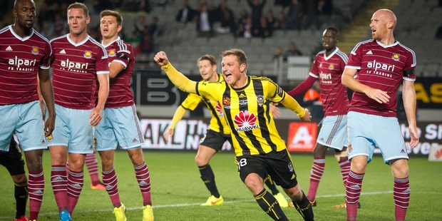 Ben Sigmund celebrates a Phoenix goal against West Ham United at Eden Park last night. Picture / Sarah Ivey