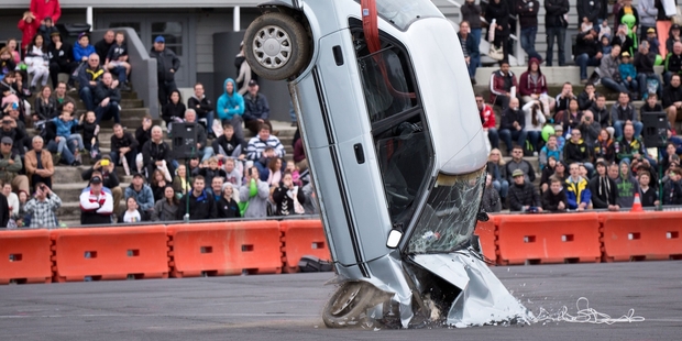 A crane drops a car to simulate a head-on crash at 60km/h. Photo / Richard Robinson