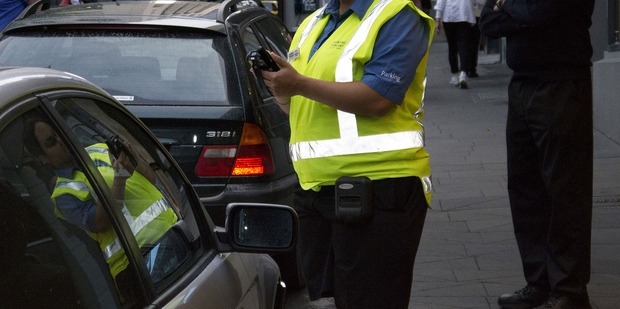 Parking warden on patrol on High Street in Auckland's CBD. Photo / Steven McNicholl