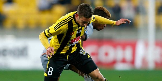 Alex Gorrin of the Phoenix is tackled by Rolando Aarons of Newcastle during the Football United New Zealand Tour match between the Wellington Phoenix and Newcastle United. Photo / Getty Images.