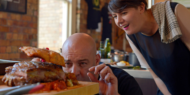 Leigh Hart adds the finishing pork crackling to his modern take on a classic lamb roast. Photo / Janna Dixon