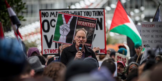 John Minto addresses the crowd at a rally to protest the Israeli ground invasion of Gaza. Photo / Herald on Sunday photograph / Michael Craig