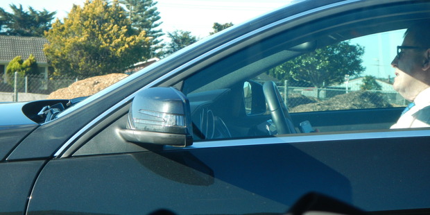 An Aucklander spotted John Banks on the Southern Motorway, phone in hand. Photo / Damien Spurdle