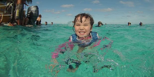 Kids love snorkelling with Captain Tama's cruise at Muri Lagoon, where they can spot giant clams and moray eels. Photo / Dave Flynn