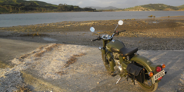 The Royal Enfield beside the Otamatea River opposite where the church that also served as a gunpowder magazine once stood.