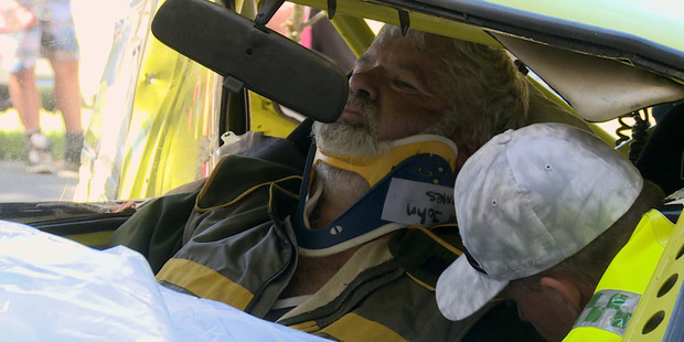 Gordon Finlay is treated by the Westpac Rescue Helicopter crew after crashing his Toyota Rally car during a Thames Car Club event in February. Photo / Westpac Rescue Helicopter