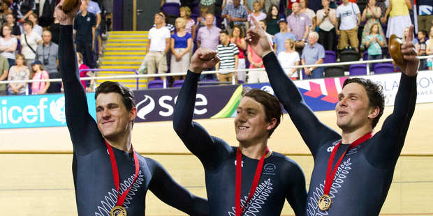 New Zealand Men's Sprint team Sam Webster, Ethan Mitchell and Eddie Dawkins celebrate their Gold Medal. Photo / Greg Bowker.