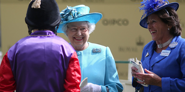 Britain's Queen Elizabeth II, centre, speaks with jockey Ryan Moore, back to camera, who rode her horse Estimate into second place in the Gold Cup at Ascot. Photo / AP