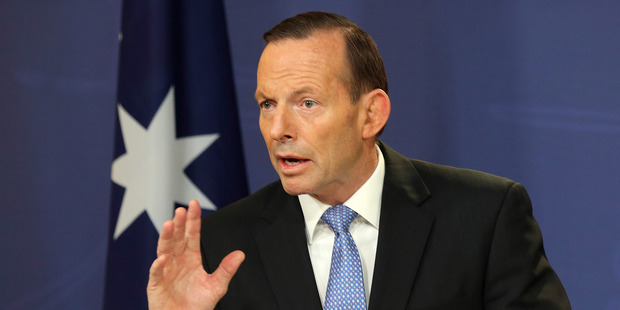 Australian Prime Minister Tony Abbott vowed to maintain pressure on Vladimir Putin after a phone call to the Russian President. Photo / AP