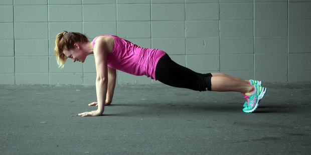 Anna Benseman demonstrates push-ups.. Photo / Doug Sherring