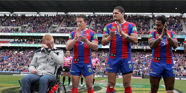 Knights players line up as a mark of respect to Alex McKinnon, left, before the Rise for Alex round. Photo / Getty Images