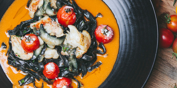 Amisfield's squid ink tagliatelle with paua, crayfish bisque and candied tomato. Picture / Supplied
