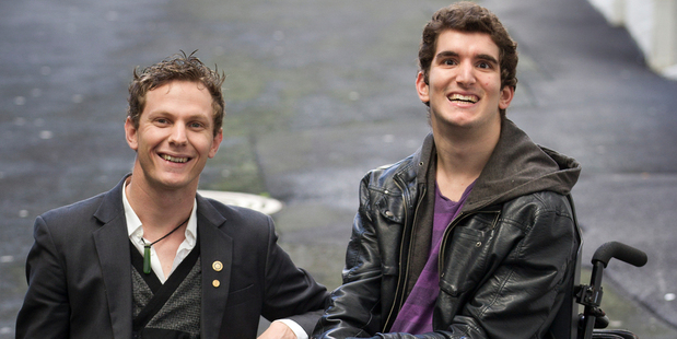 AMP Do Your Thing recipient Cameron Calkoen, left, is founder of Carabiner - a program that links motivated individuals with experienced mentors. He helped Jordon Milroy, right, climb the Sky Tower to raise money for wheelchairs in Samoa. Photo / Greg Bowker