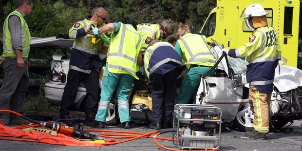 PILE-UP: Emergency crews cut free a driver in a December crash at Waingawa. The driver responsible argued a vehicle ahead of him hadn't pulled off the road before making a turn.