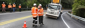 HIGH FIVE: Downer zero harm adviser Des Ryan gives Anthony Scott a congratulatory high five as the last touches are finished on the repair work on a slip on the Brynderwyn Hills. PHOTO/MICHAEL CUNNINGHAM