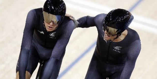 Aaron Gate, left, receives a pat on the should by Sam Bewley as they cross the line to take the bronze medal at the Olympic Games. Photo / Mark Mitchell