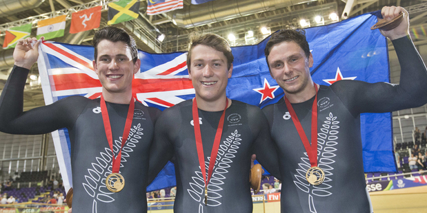 Sam Webster, Ethan Mitchell and Eddie Dawkins celebrate their gold medal at the Commonwealth Games. Photo / Greg Bowker