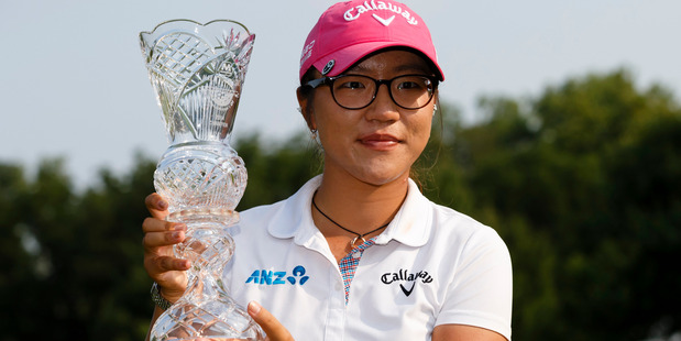 Lydia Ko, of New Zealand, holds up her trophy after winning the Marathon Classic LPGA tournament. Photo / AP